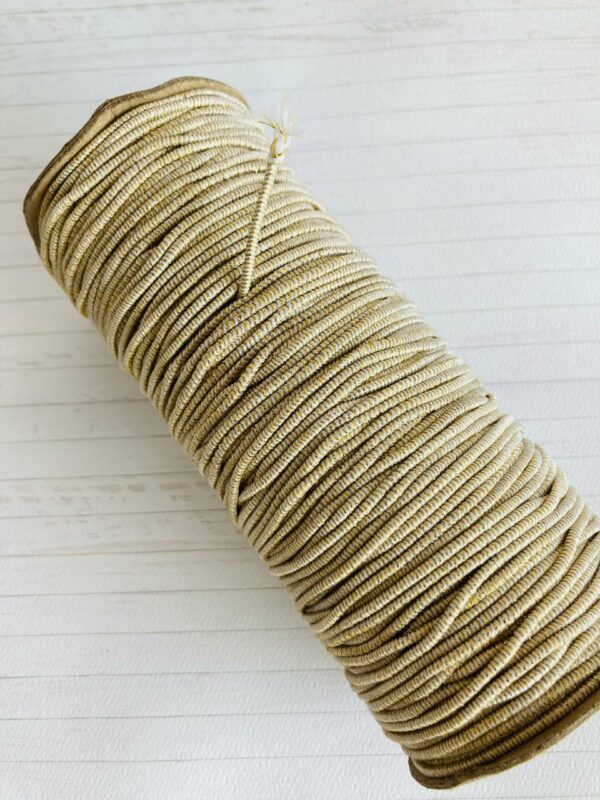 11162115 Elastico tubular 2mm color Blanco con glitter dorado carrete 100m