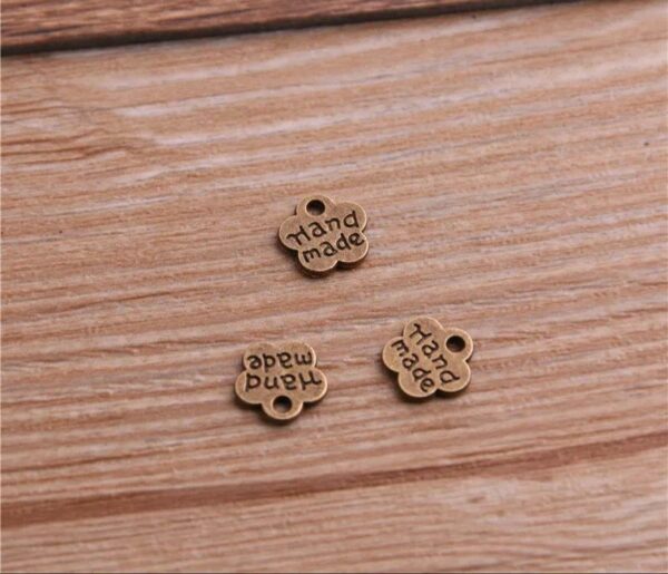 60111410 Decoración Flor metal "hand made" 8 x 8 mm - color bronce